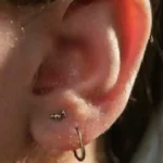Close-up of detailed pierced ear