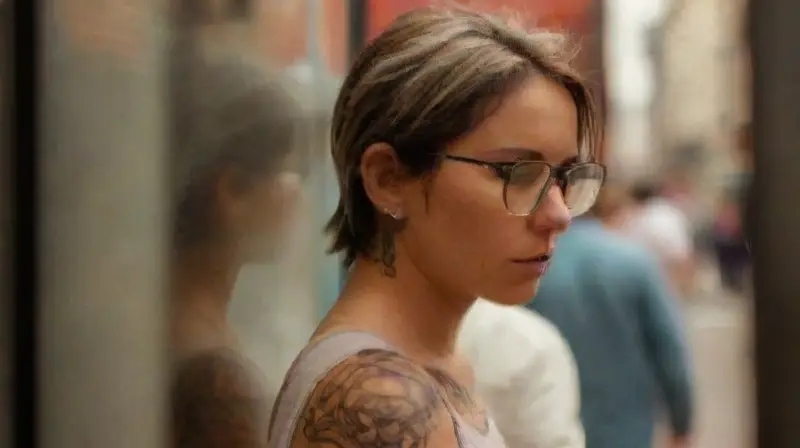 Crowded outdoor tattoo convention with diverse visitors