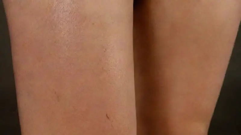 Close-up of woman’s thigh with detailed tattoo
