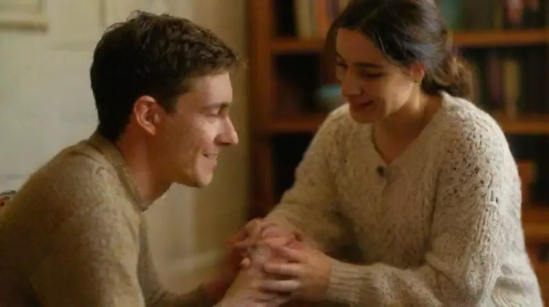 People sharing warm, supportive indoor conversation