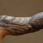 Detailed realistic tattoo on forearm