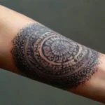 Black ink mandala tattoo enhances realistic skin