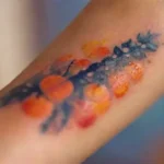 Close-up of colorful tattoo in festival setting