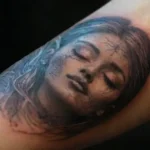 Hyper-realistic tattooed forearm with detailed shading