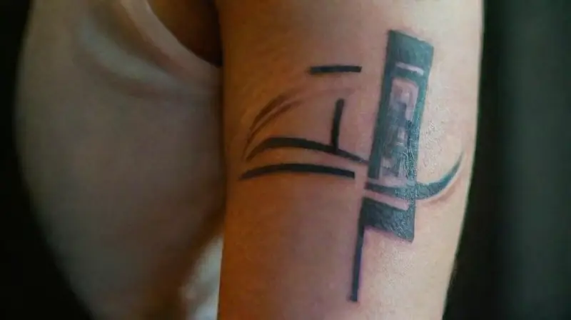 Cyberpunk arm tattoo with glowing cyber details