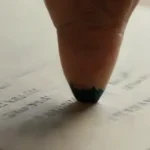 Close-up of detailed handwritten document and desk