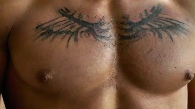 Close-up of tattooed male upper torso
