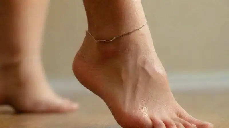 Close-up of ankle with jewelry detail