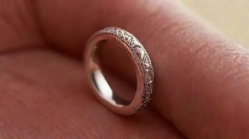 Detailed platinum ear piercing with reflective shine