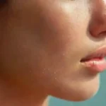 Close-up of a decorated pierced earlobe